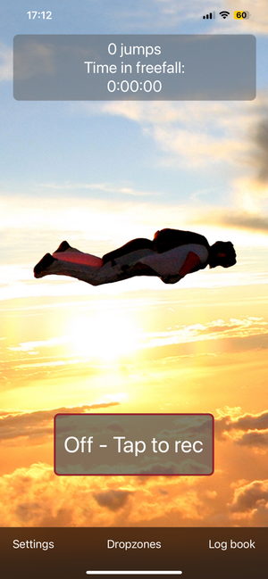 Screenshot of the Skydive Logger app showing a silhouette of a skydiver in tracking position against a sunset sky, with a counter showing 0 jumps and 0:00:00 freefall time.