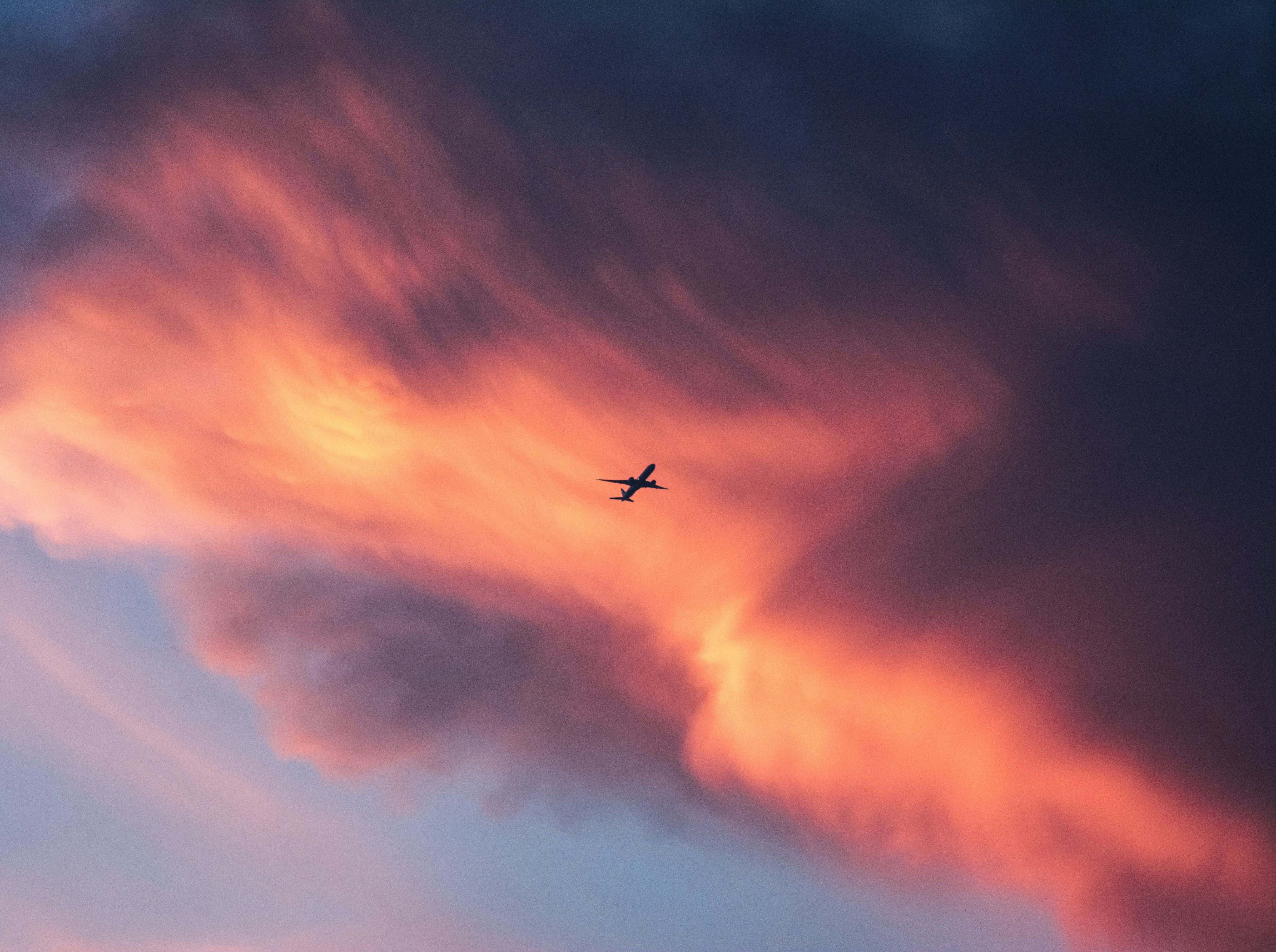 Scattered clouds catching vibrant golden hour light, the broken cloud cover that makes a good sunset